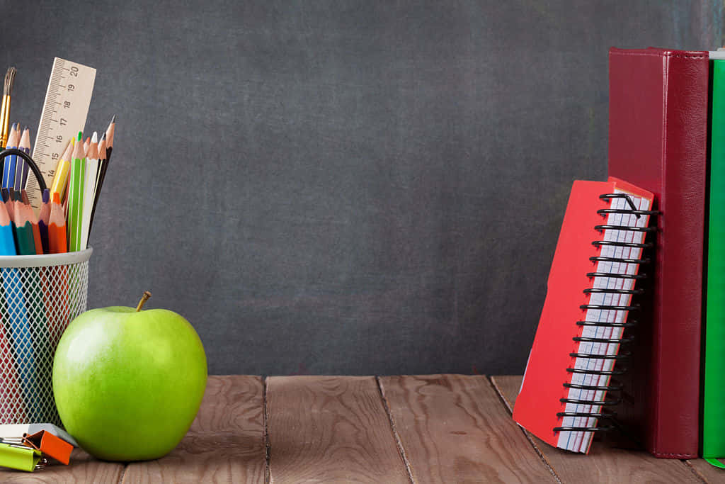 Neat Desk Of An Educated Teacher Wallpaper