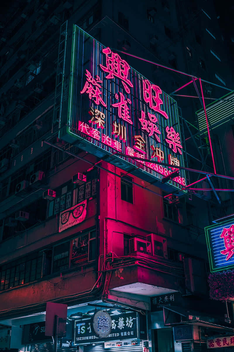 Neon Sign On A Building Wallpaper