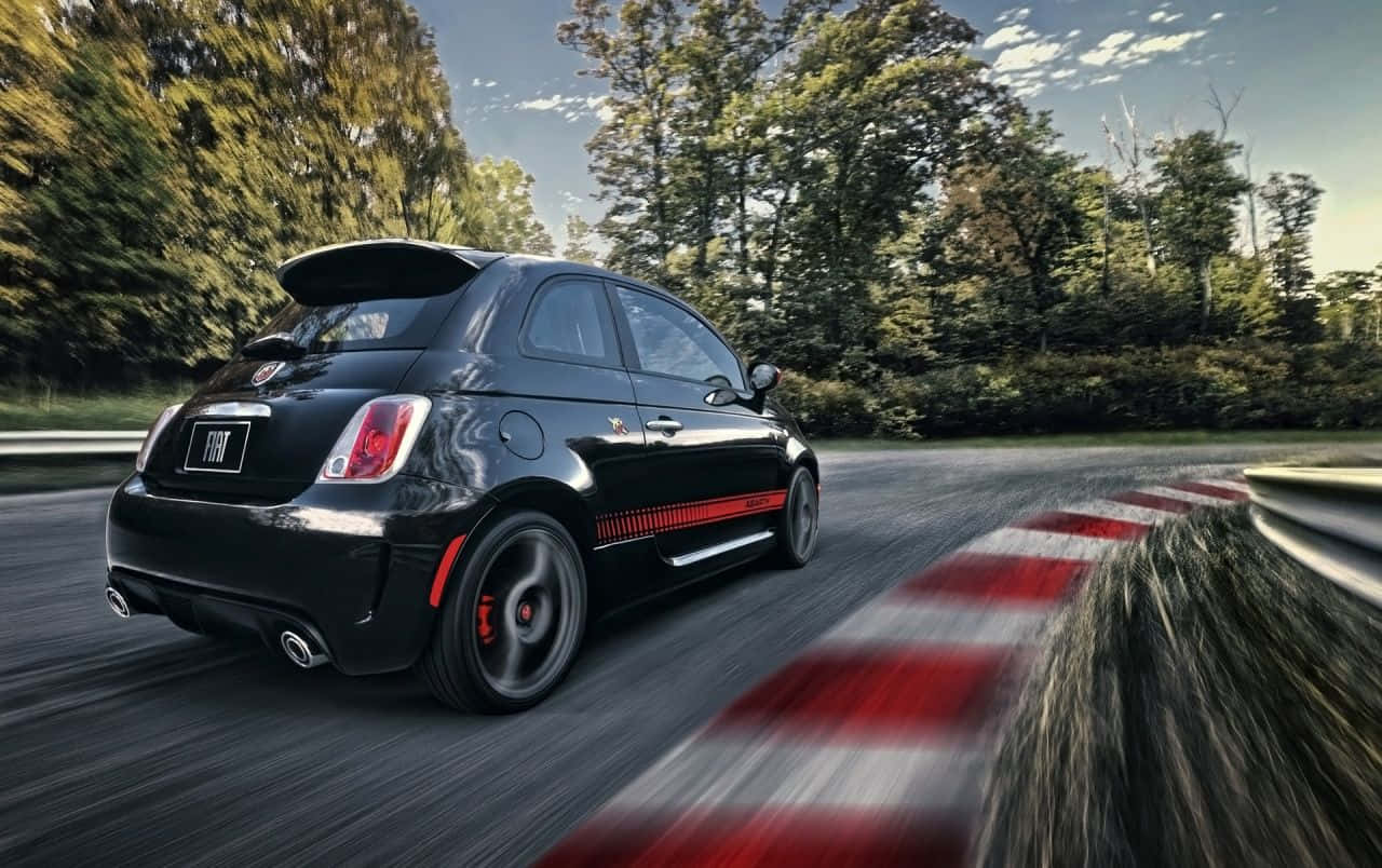 New Fiat 500l Model On A Scenic Road Wallpaper