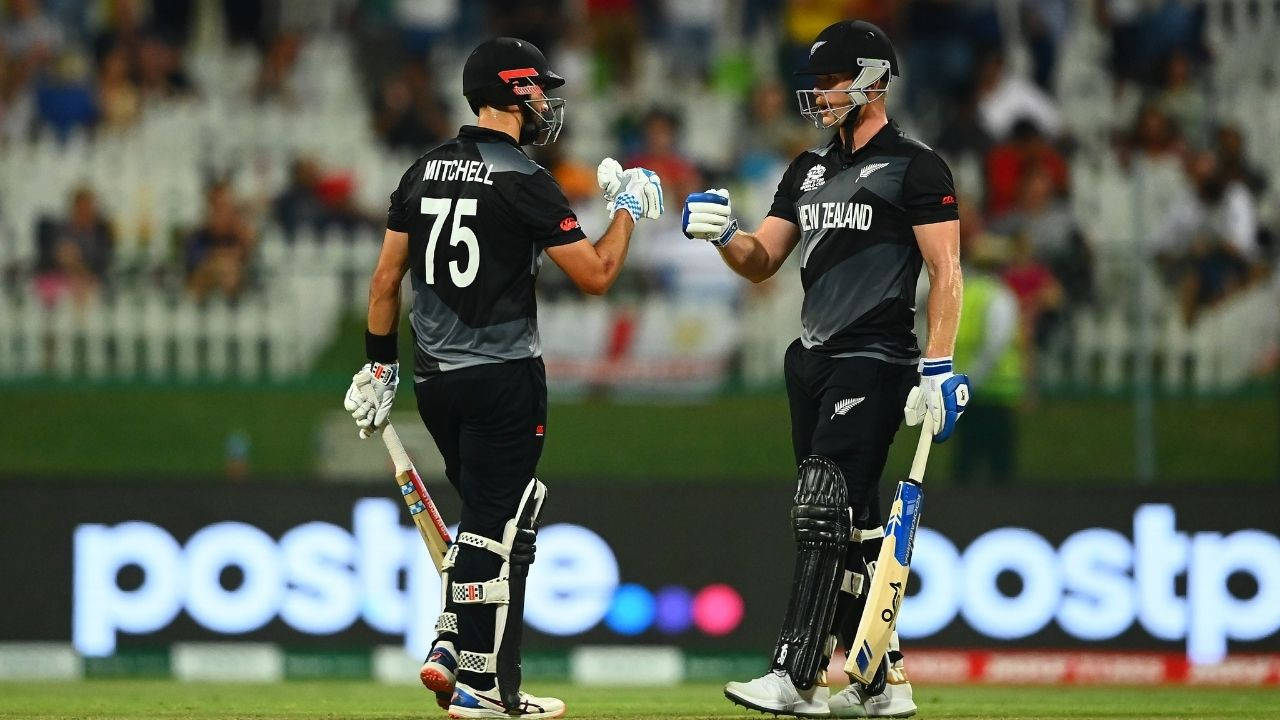 New Zealand Cricket Players Fist Bumping Wallpaper