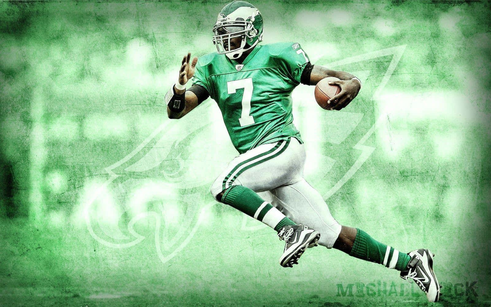 Nfl Great Michael Vick On The Field In His Prime Wallpaper