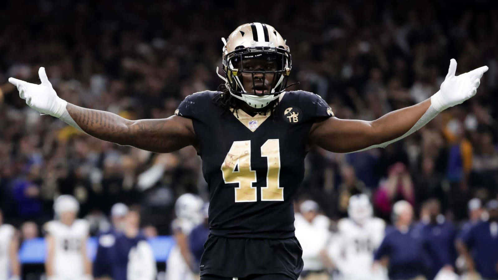 Nfl Running Back Alvin Kamara Takes Off With The Ball Wallpaper