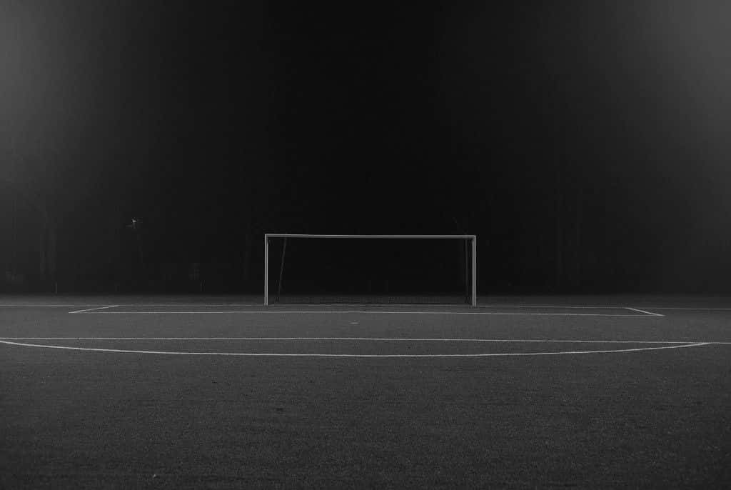 Nighttime Soccer Goal Empty Field Wallpaper