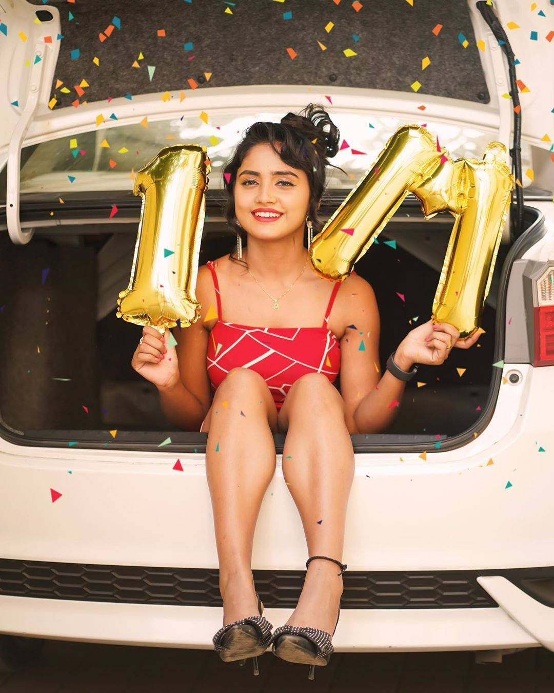 Nisha Guragain Holding Gold Balloons Wallpaper