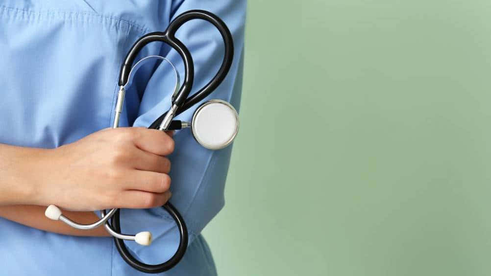 Nurse Holding Stethoscope.jpg Wallpaper