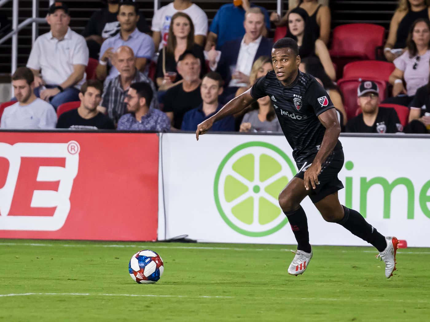 Ola Kamara D.c. United Ready To Kick Ball Wallpaper