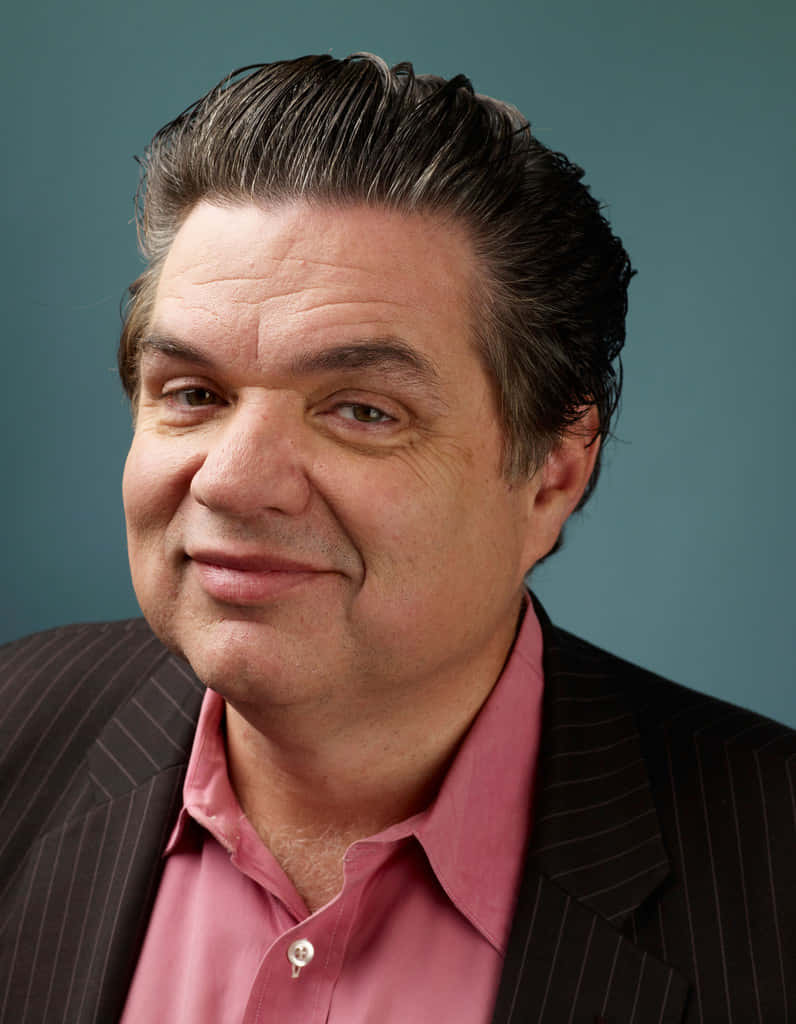 Oliver Platt Looks Intense In An Outdoor Setting Wallpaper