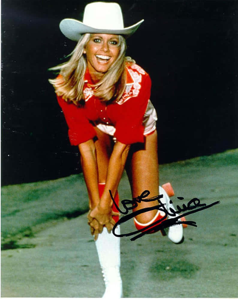 Olivia Newton John On Roller Skates Wallpaper