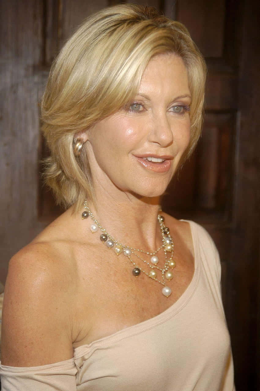 Olivia Newton John With Short Hair Wallpaper