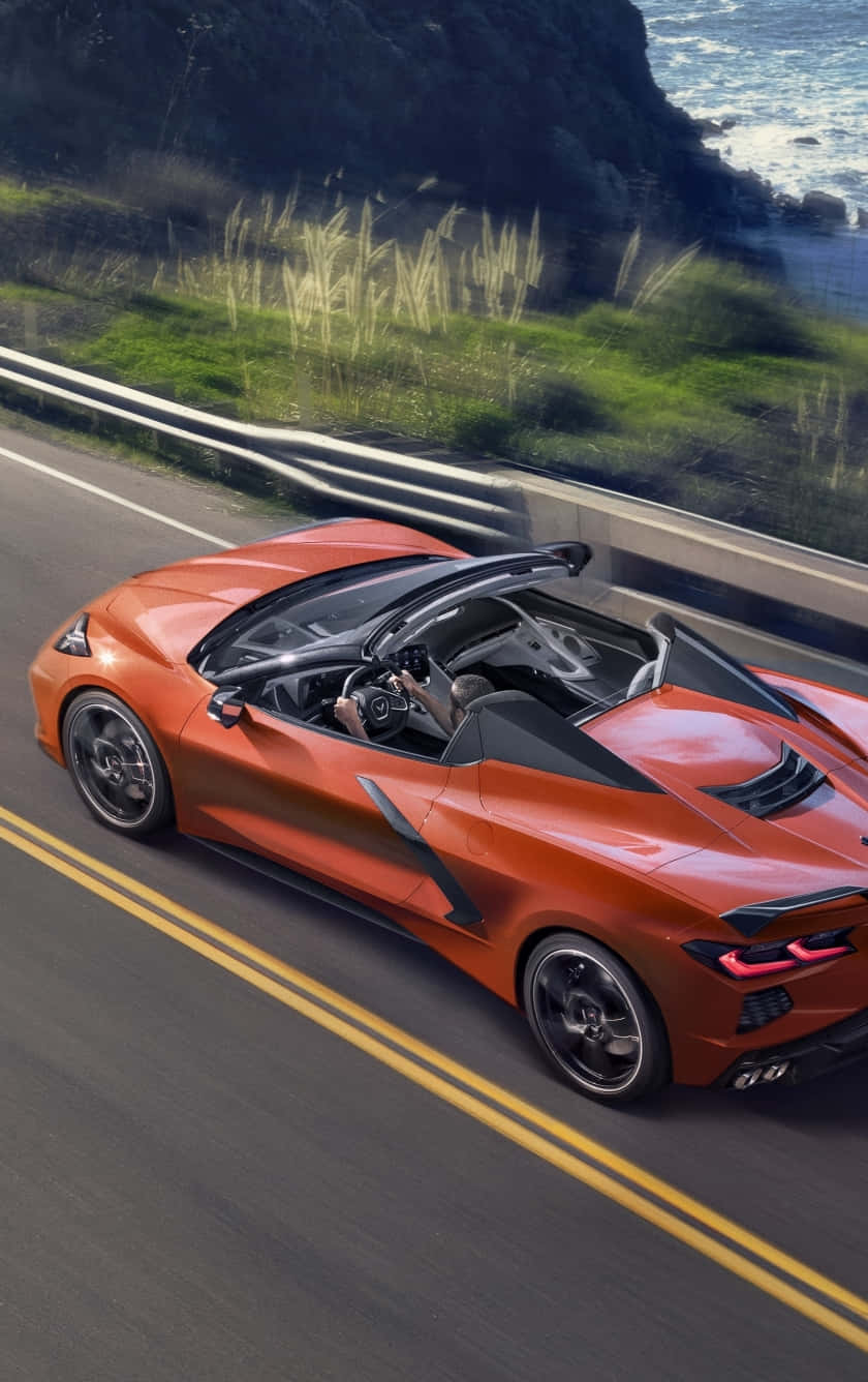 Orange Corvette C8 Convertible Coastal Road Wallpaper