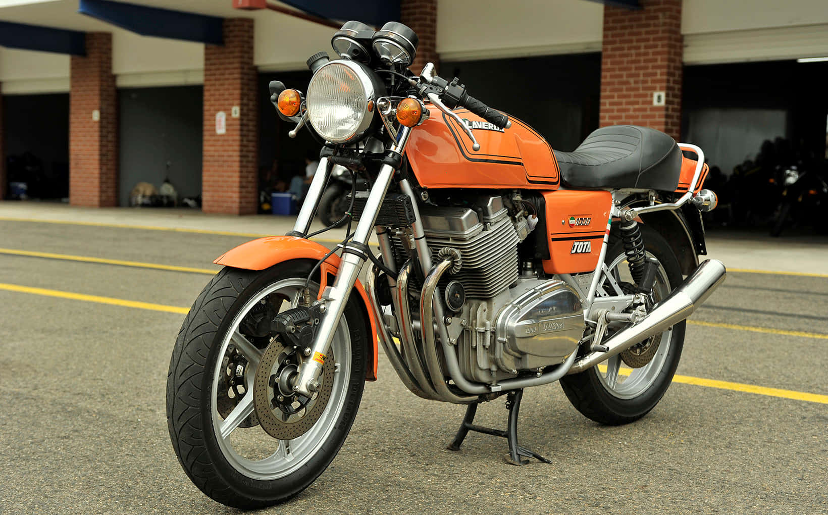 Orange Laverda Motorcycle Parked Wallpaper