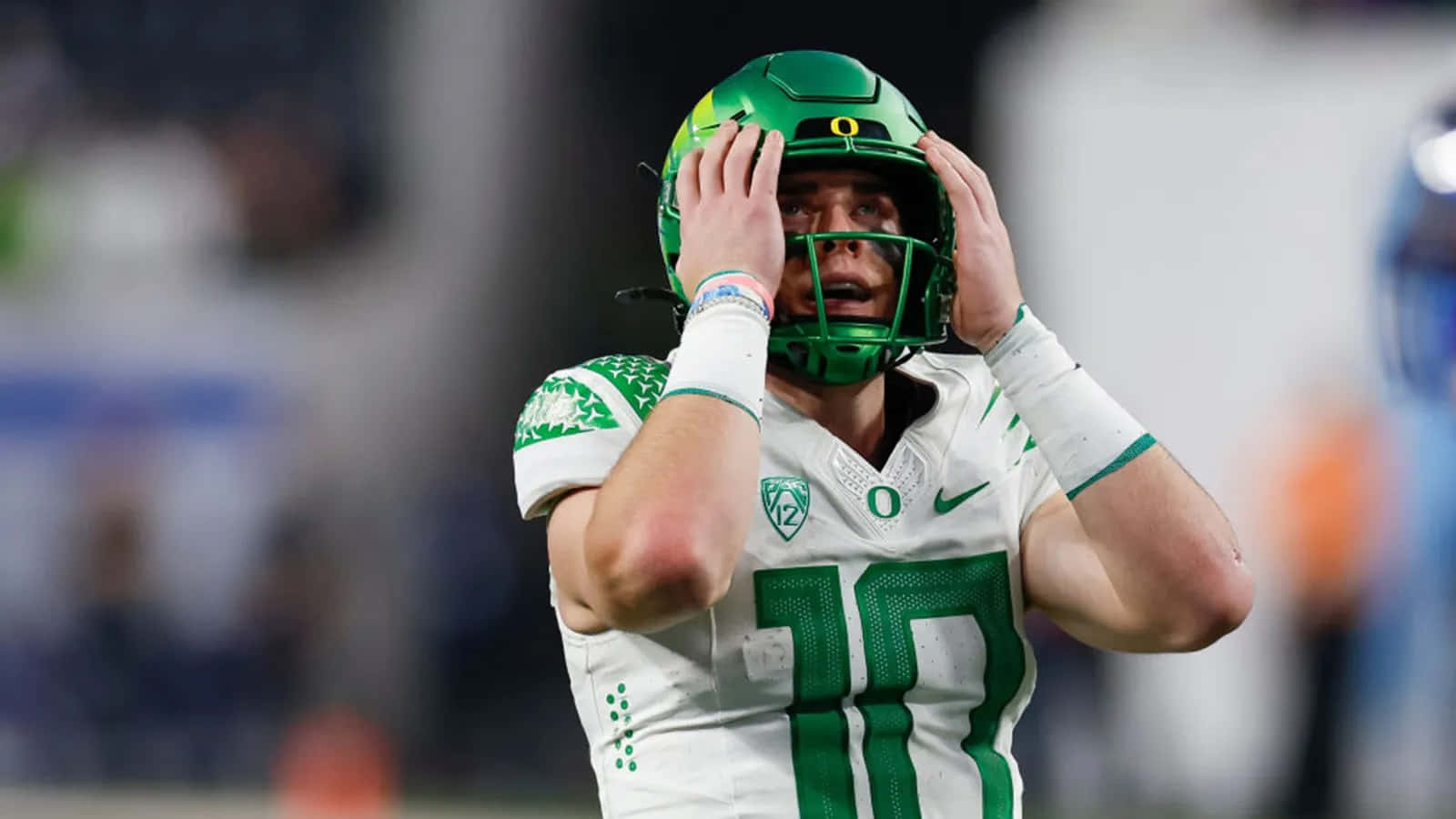 Oregon Ducks Quarterback Bo Nix Adjusting Helmet Wallpaper