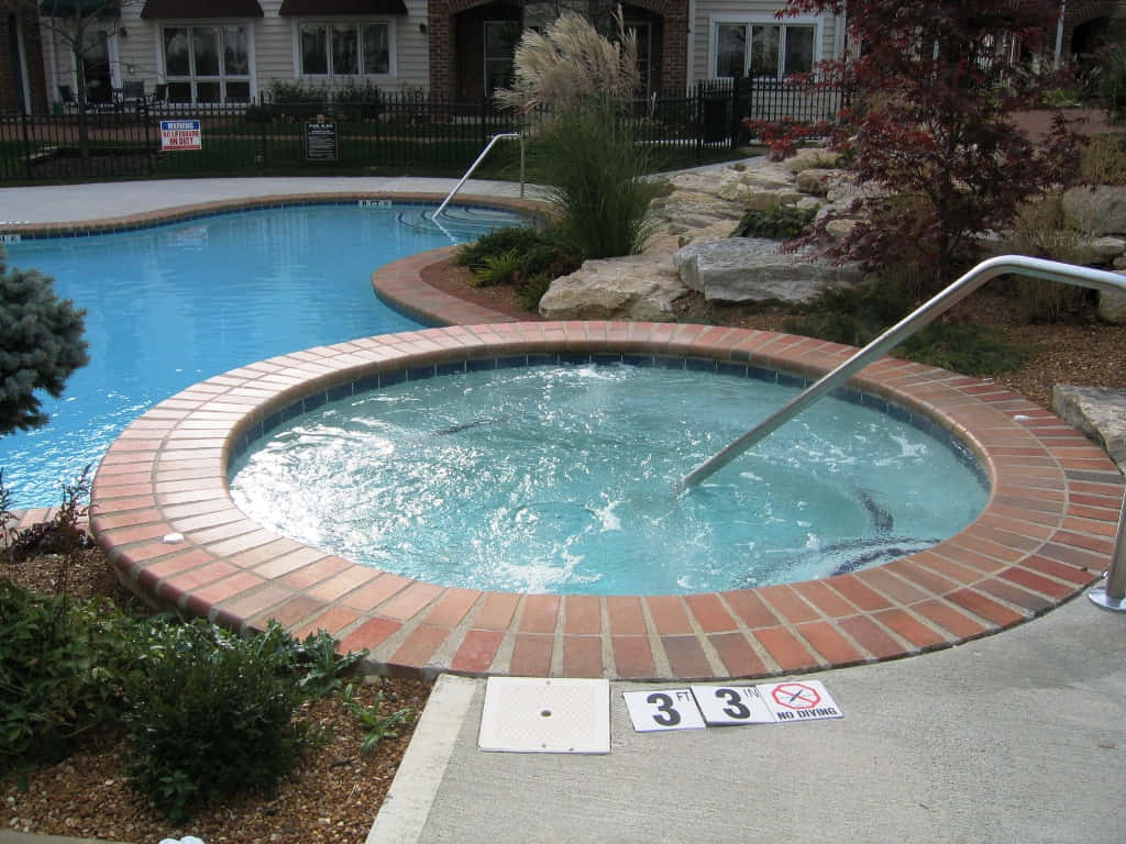 Outdoor Hot Tub Beside Swimming Pool Wallpaper