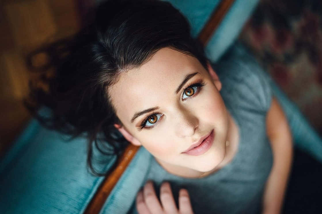 Overhead Portrait Young Woman Gazing Up Wallpaper