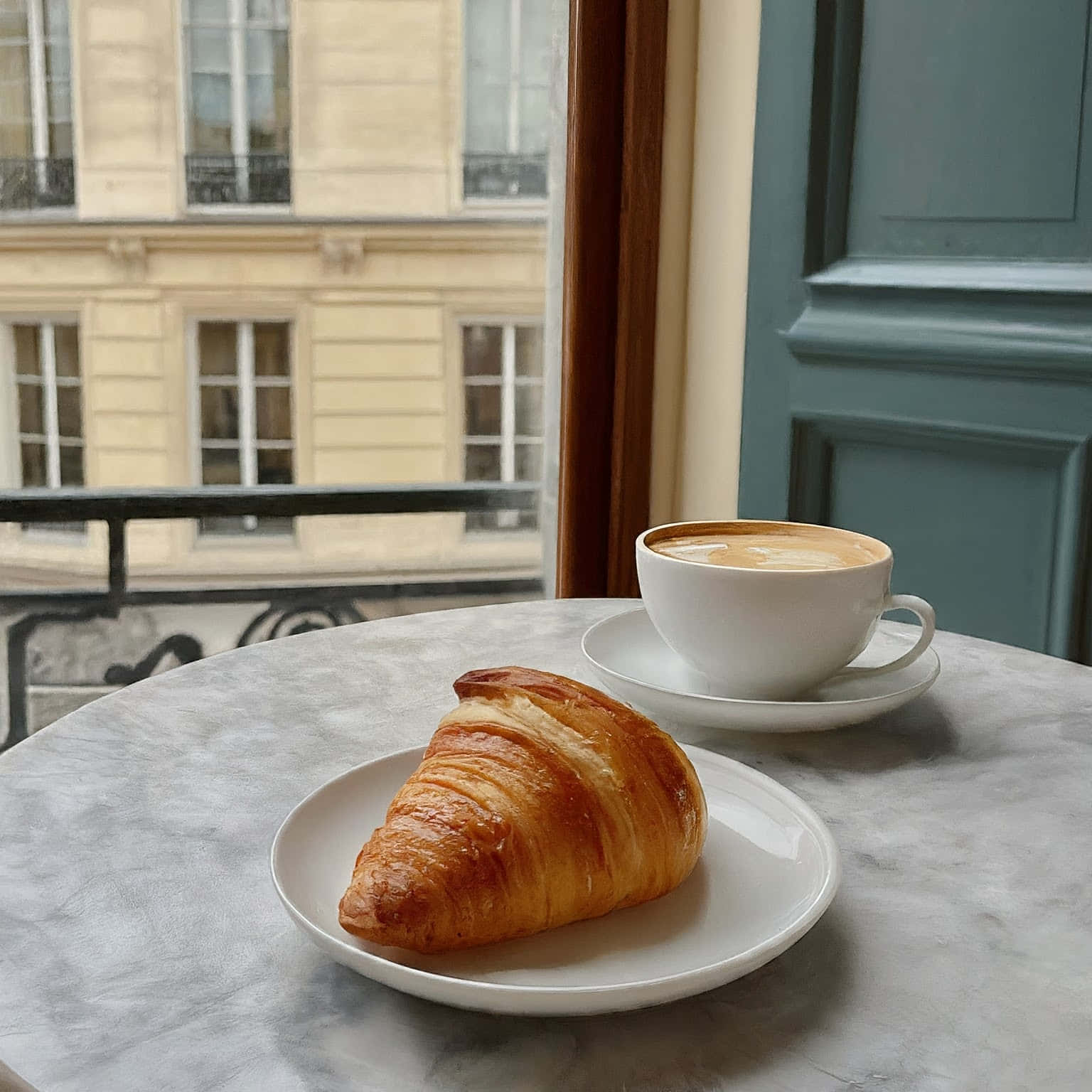 Parisian Coffeeand Croissant Scene Wallpaper