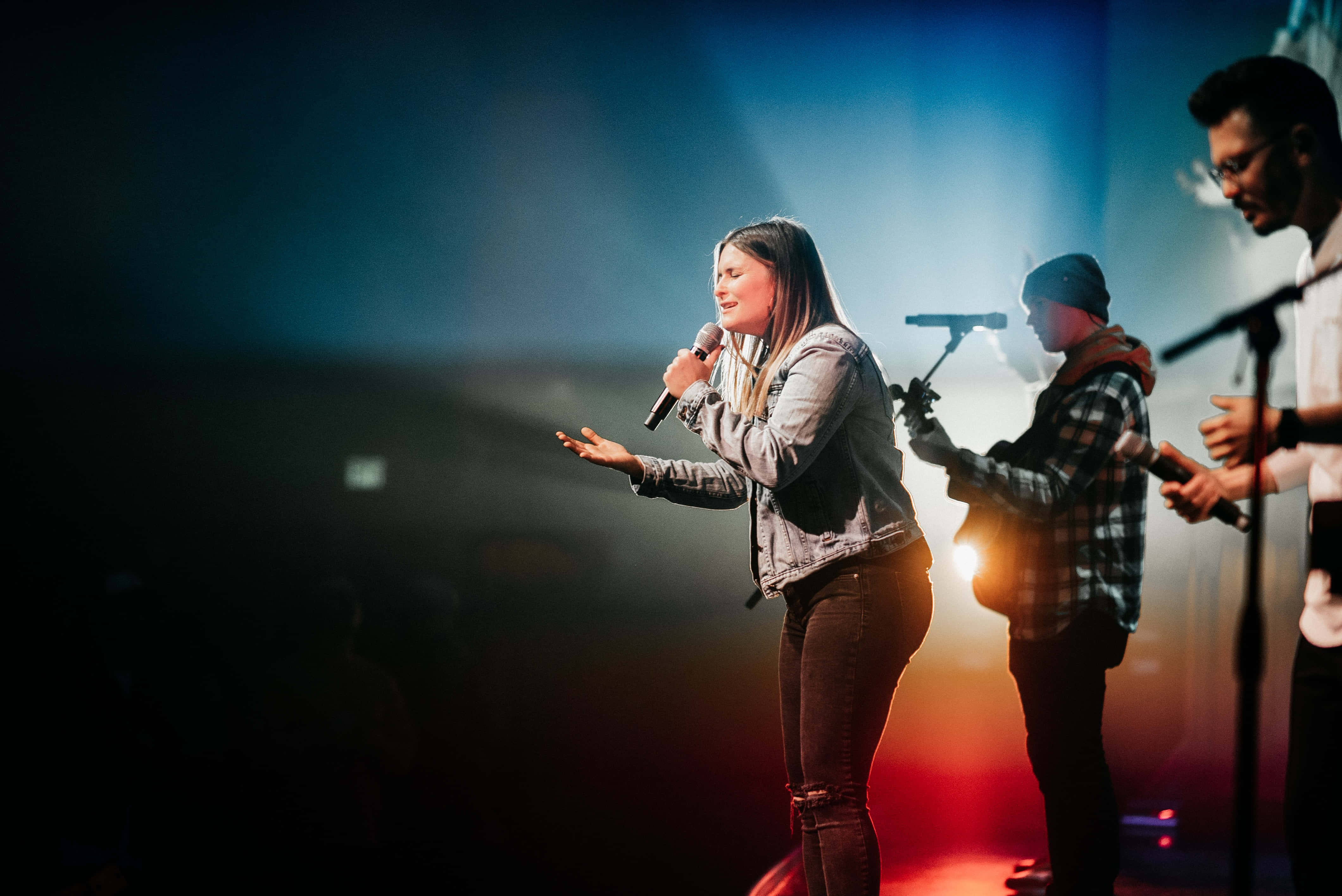 Passionate Christian Worship Leader Engages Congregation Wallpaper