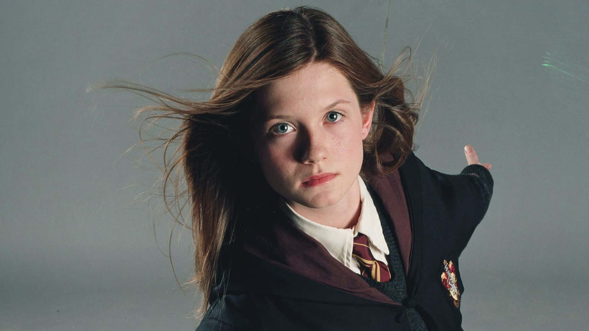 Passionate Ginny Weasley In Action Wallpaper