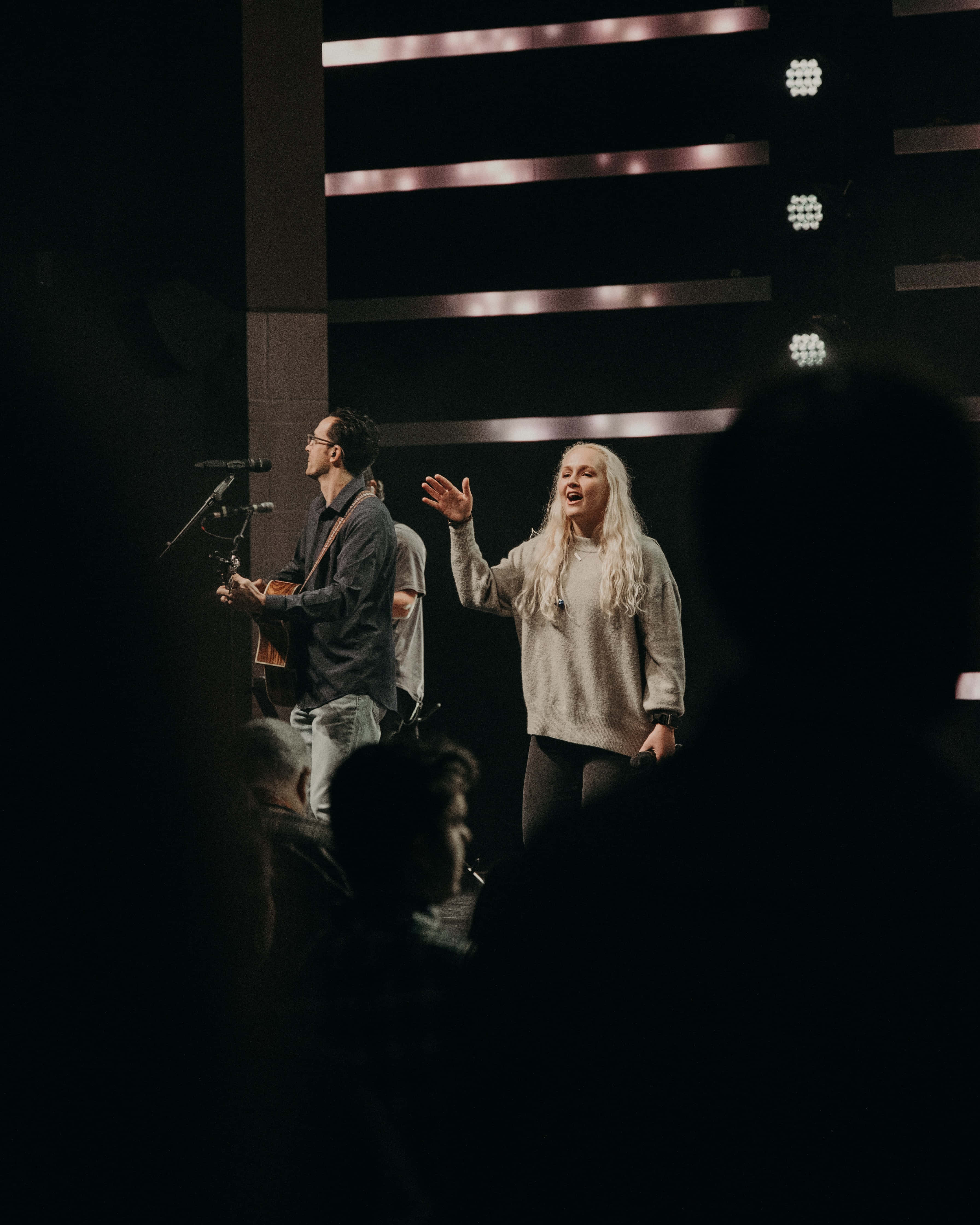 Passionate Worship Leader Engaging The Congregation Wallpaper