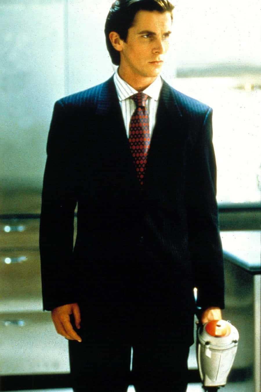 Patrick Bateman Suitand Briefcase Wallpaper