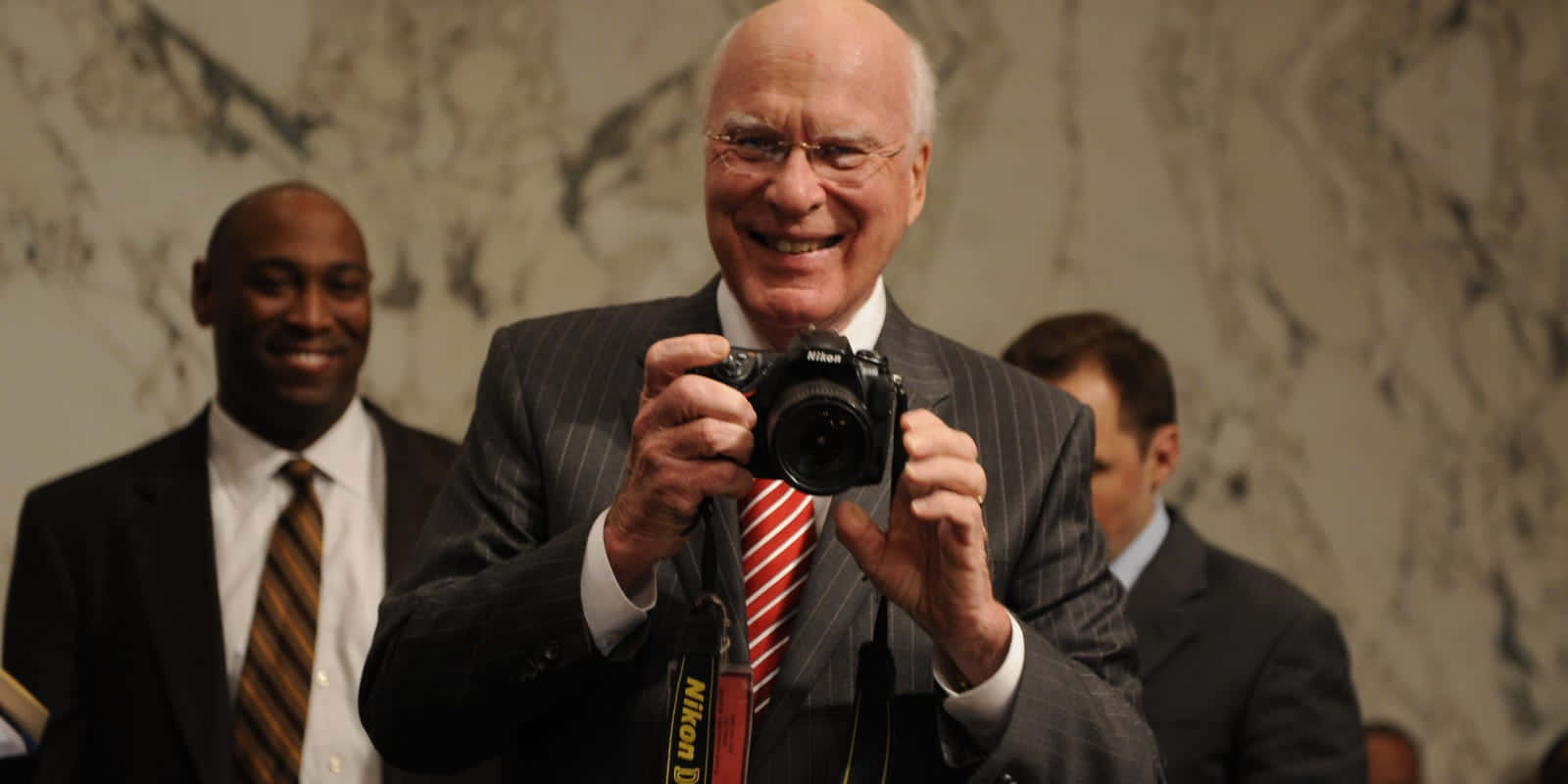 Patrick Leahy Holding A Camera Wallpaper