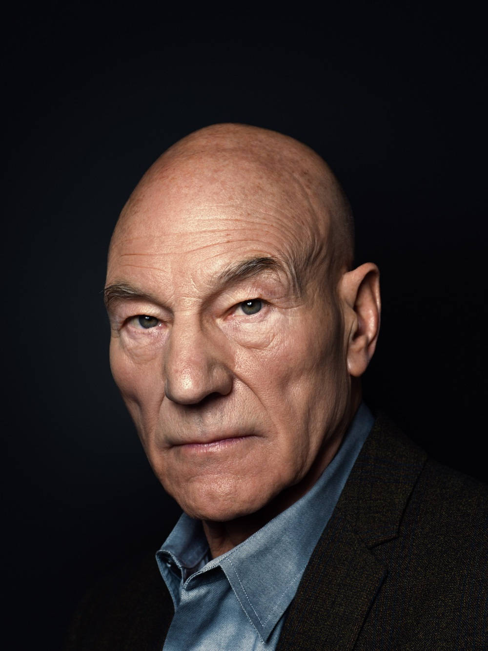 Patrick Stewart On A Dark Background Wallpaper