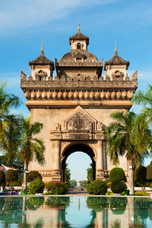 Patuxai Monument Reflecting On Water Wallpaper