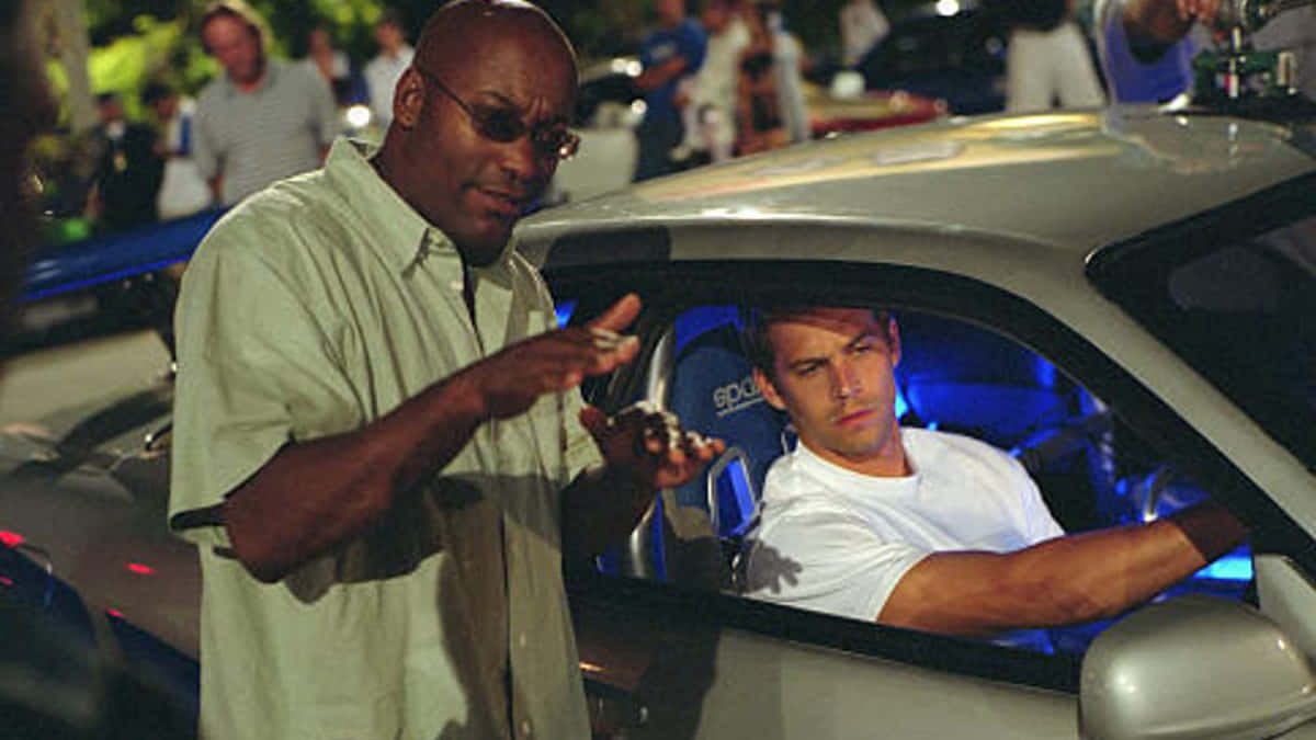 Paul Walker Behind The Wheel Of A Nissan Skyline Wallpaper