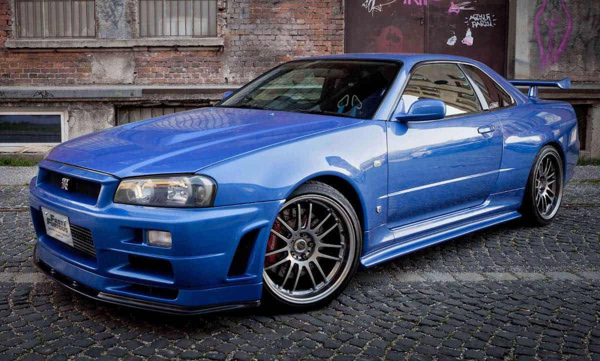 Paul Walker Driving Nissan Skyline In Street Race Wallpaper