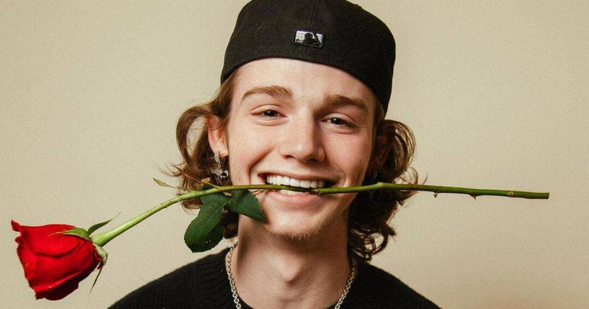 Payton Moormeier Biting A Rose Wallpaper