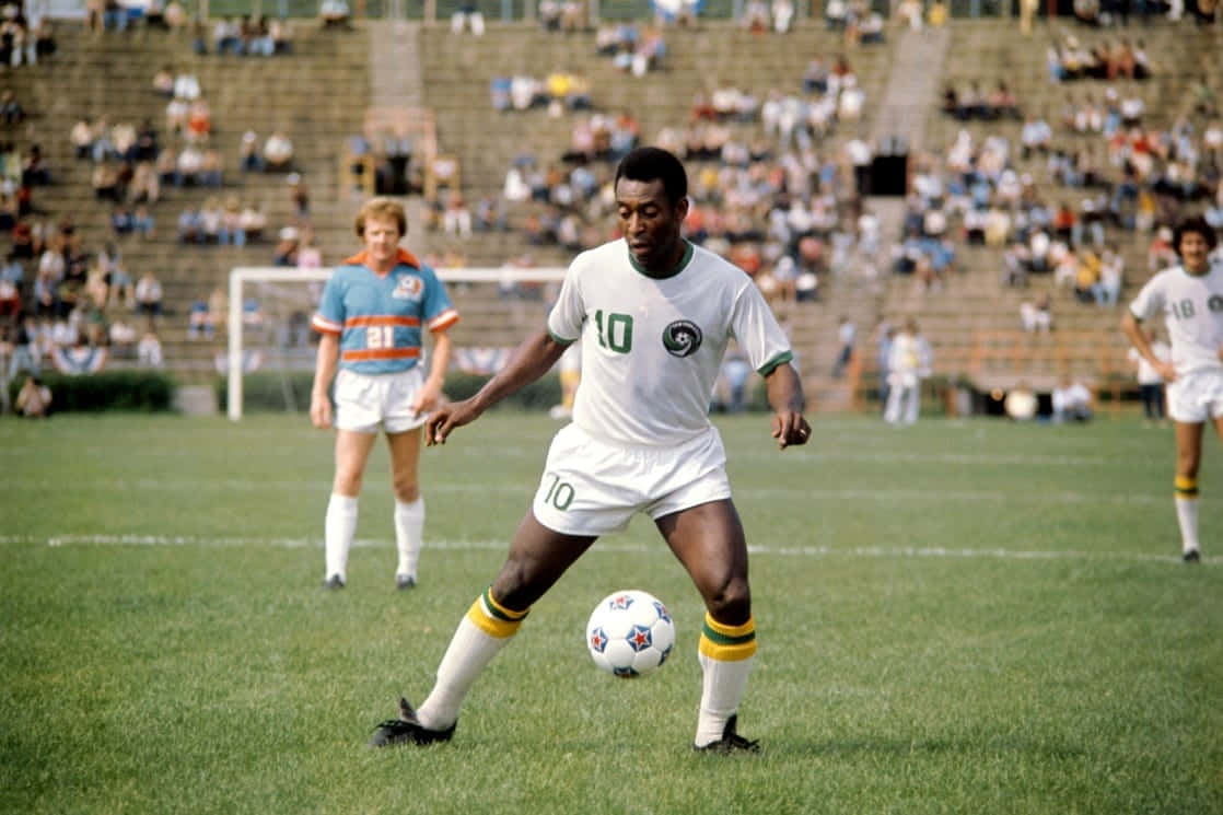 Pele Playing Soccer On Field Wallpaper