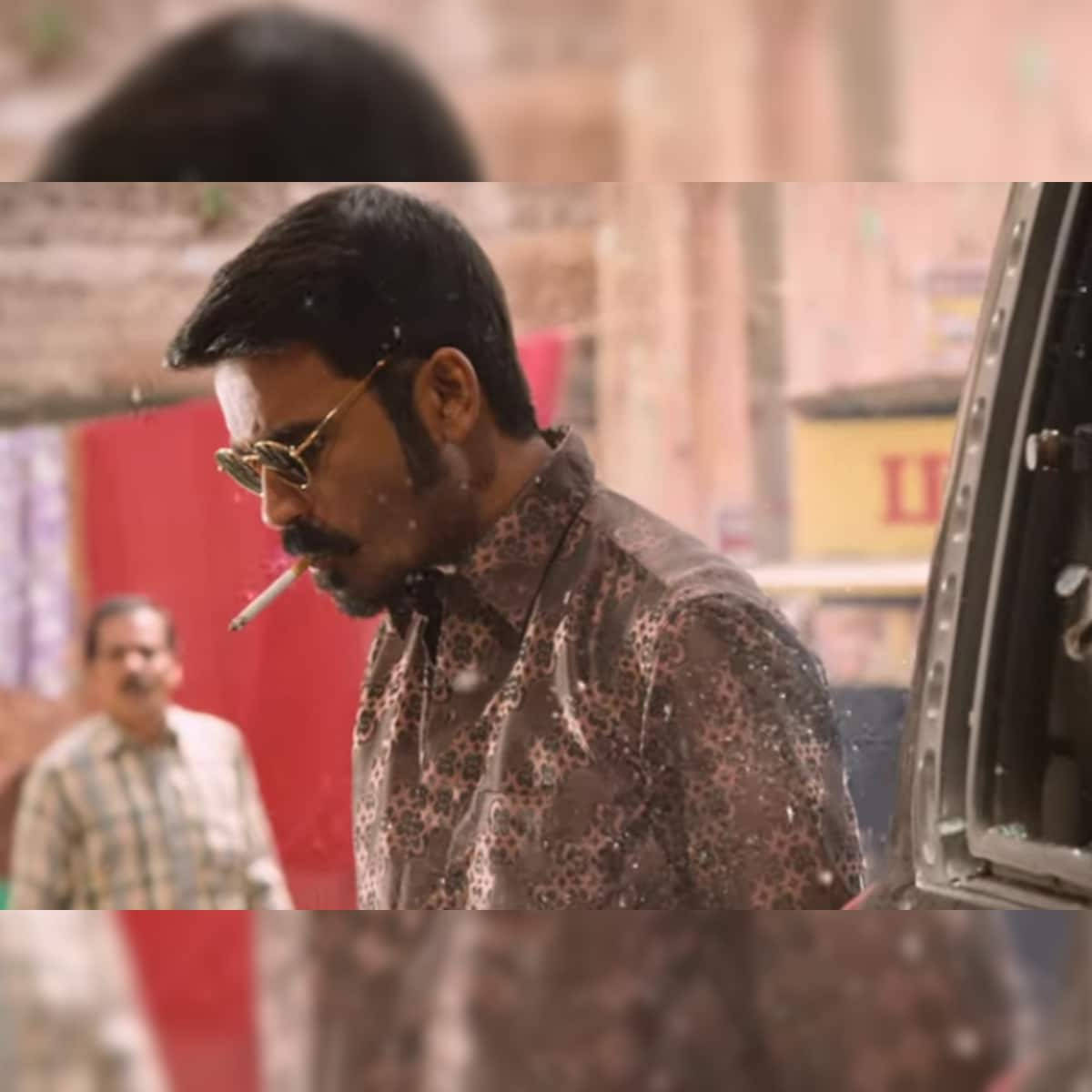 Pensive Smoking Dhanush Wallpaper