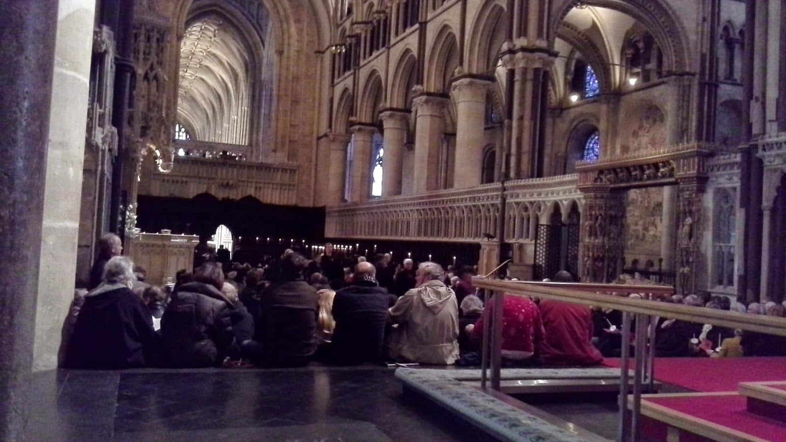 People Gathered At The Canterbury Cathedral's Quire Wallpaper