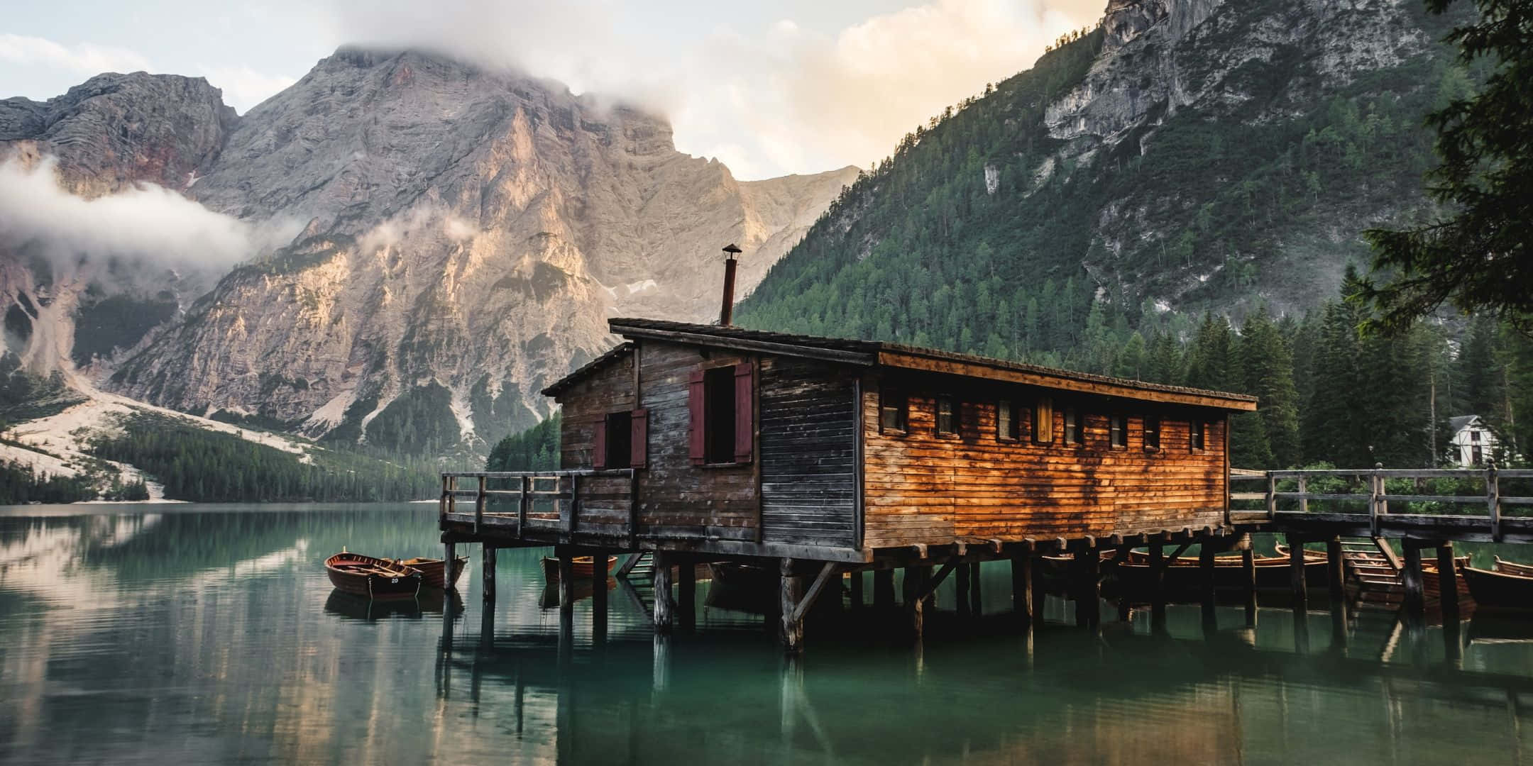 Person Walking A Lake Side Trail Wallpaper