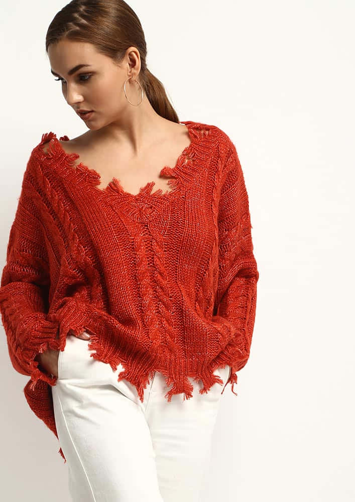 Person Wearing A Stylish Red Sweater Wallpaper