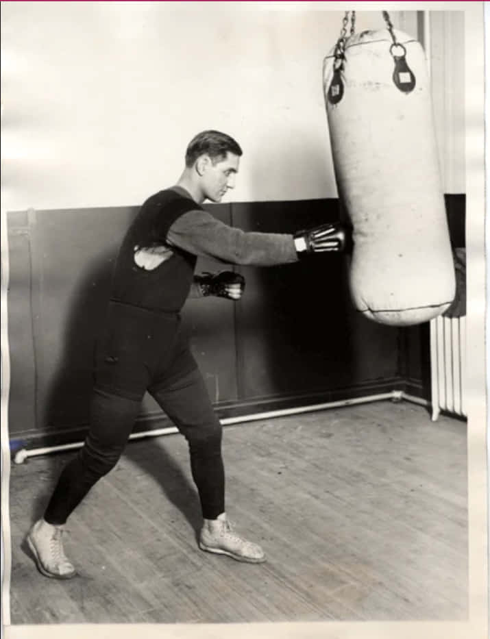 Pete Latzo Throws A Punch At The Punching Bag Wallpaper