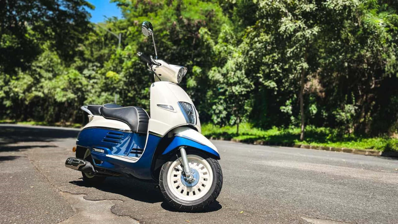 Peugeot Scooter Parked Outdoors Wallpaper