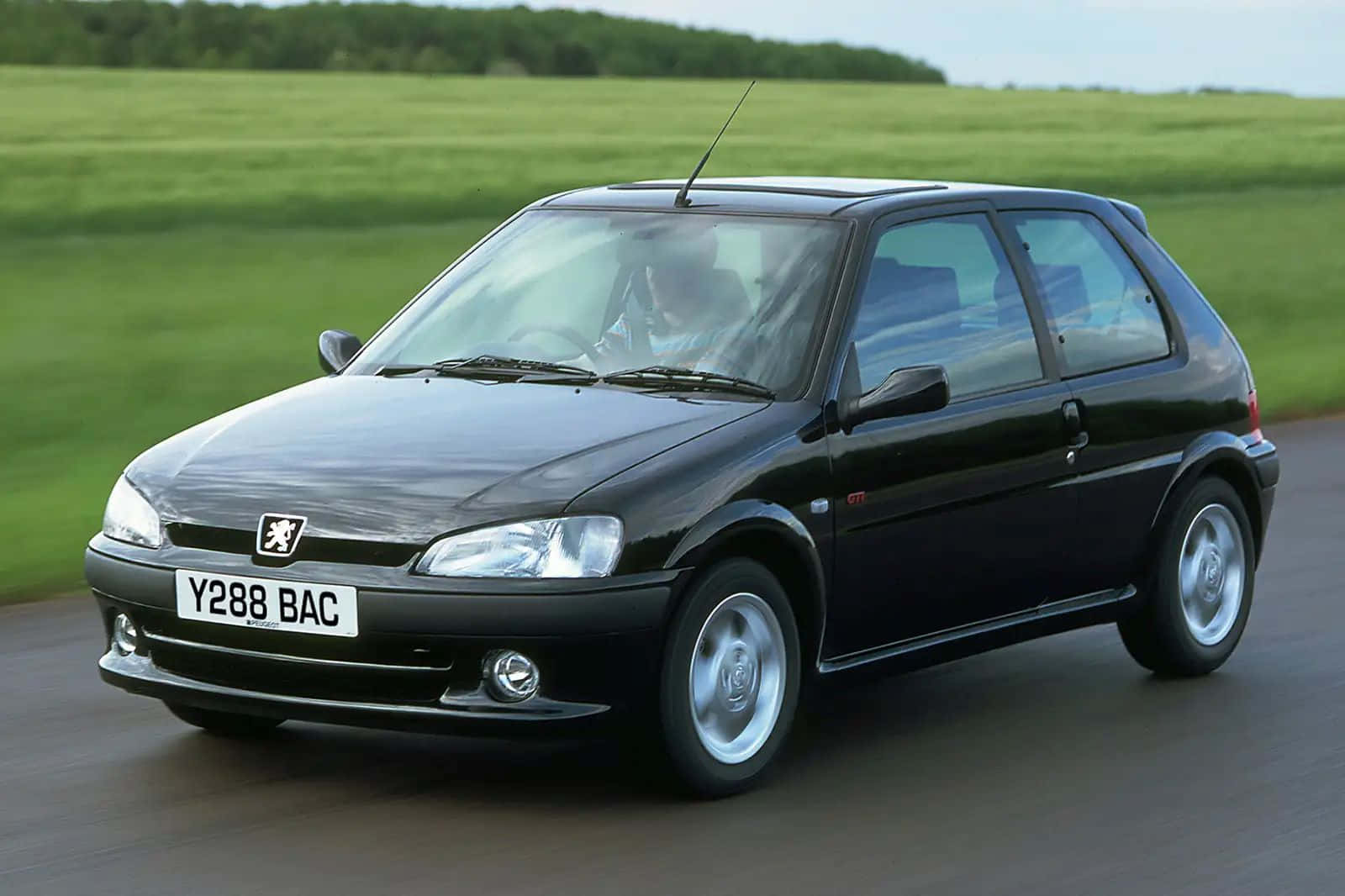 Peugeot106 Black Hatchback Motion Wallpaper