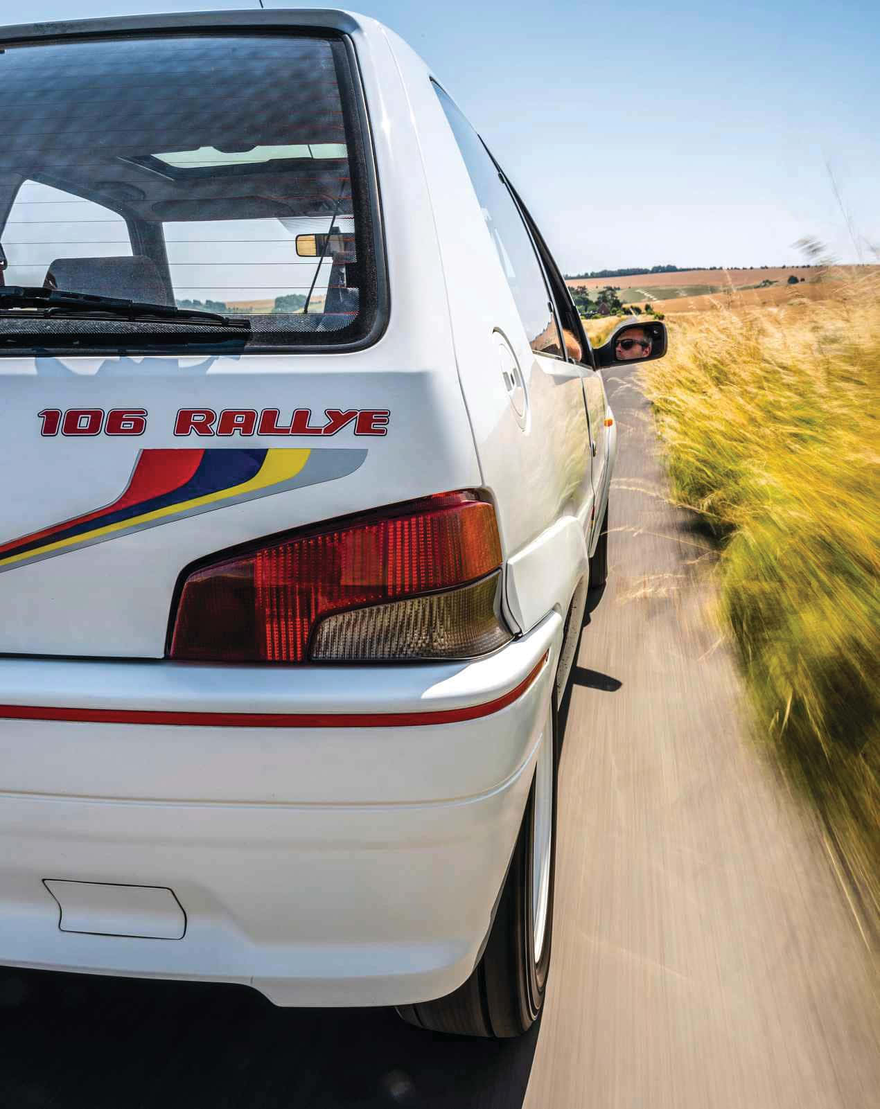 Peugeot106 Rallye Rear View On Road Wallpaper