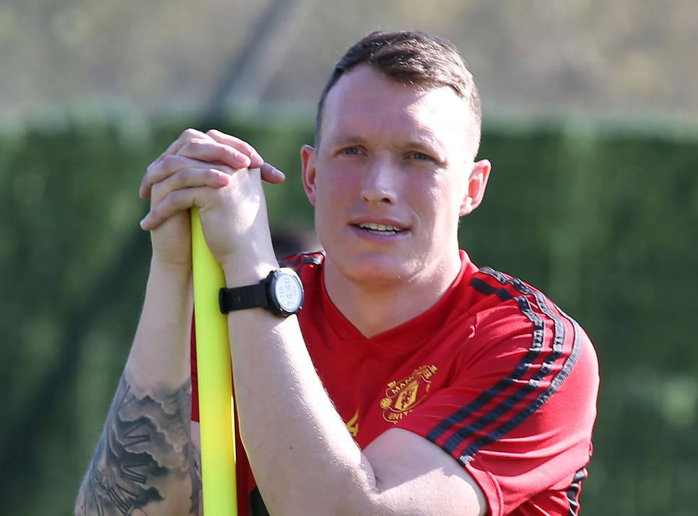 Phil Jones Training With A Yellow Pole Wallpaper