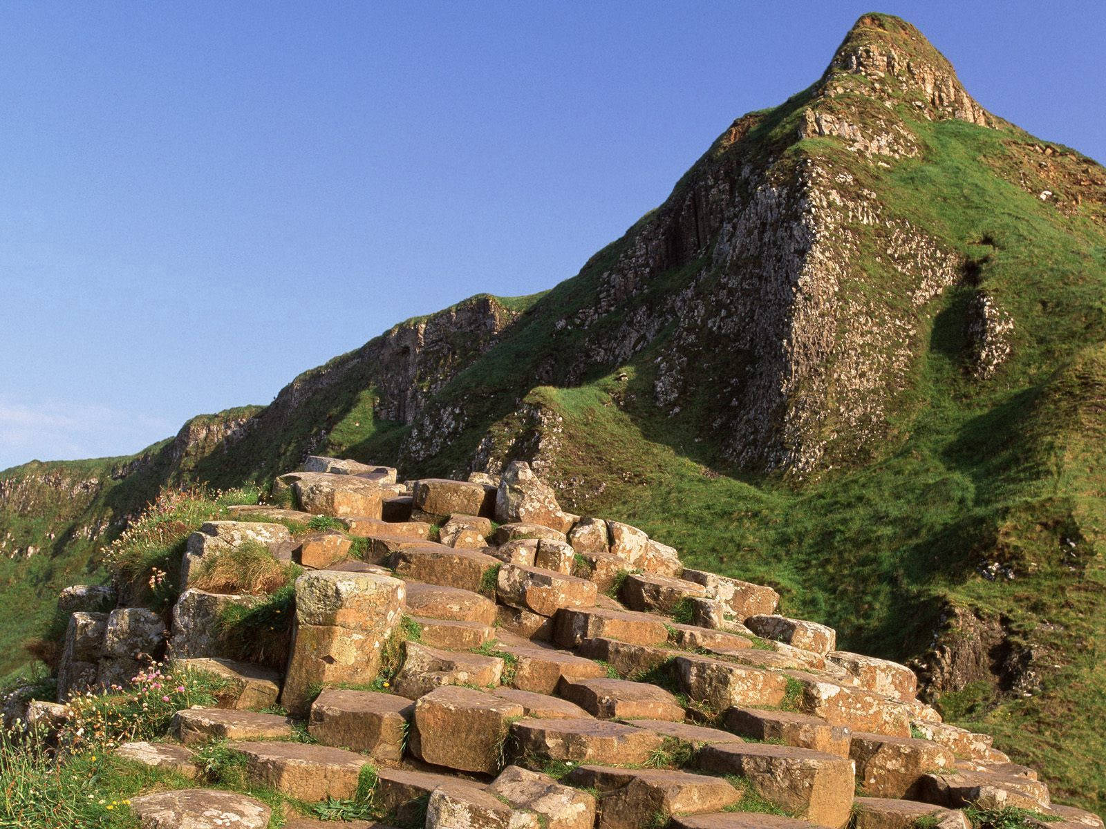 Photo Standing Atop The Giant's Causeway In Antrim County, Ireland Wallpaper