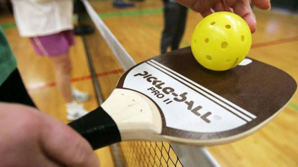 Pickleball Paddleand Ball Closeup Wallpaper