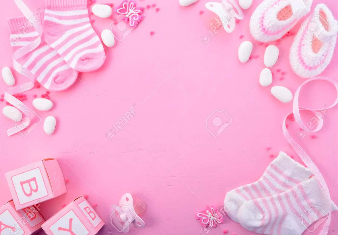 Pink Baby Shower Background With Baby Items And Toys Wallpaper