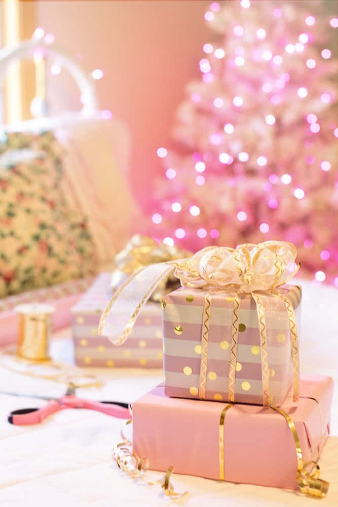 Pink Christmas Giftsand Tree Wallpaper