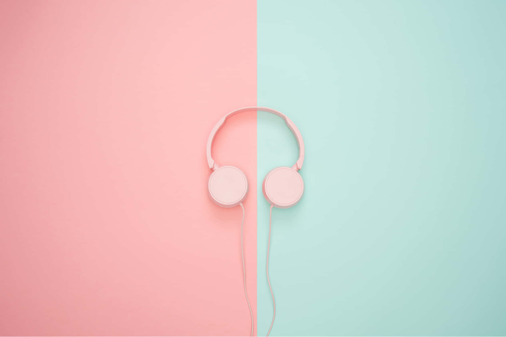 Pink Headphones On A Pink And Blue Background Wallpaper