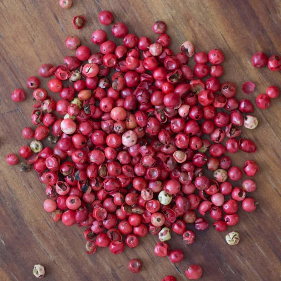 Pink Peppercorns In A Wooden Bowl Wallpaper