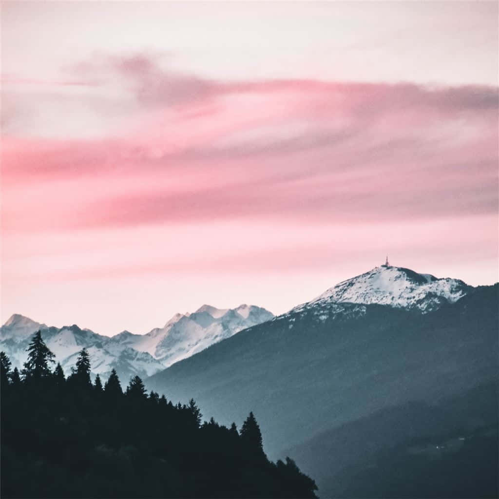 Pink_ Sunset_ Over_ Snowy_ Mountain_ Peaks Wallpaper