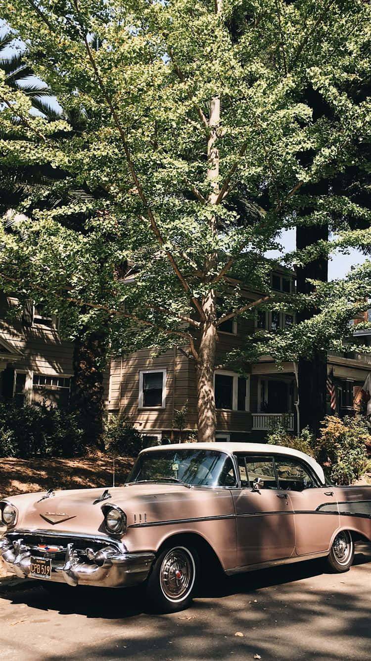 Pink Vintage Car Parked Iphone Wallpaper