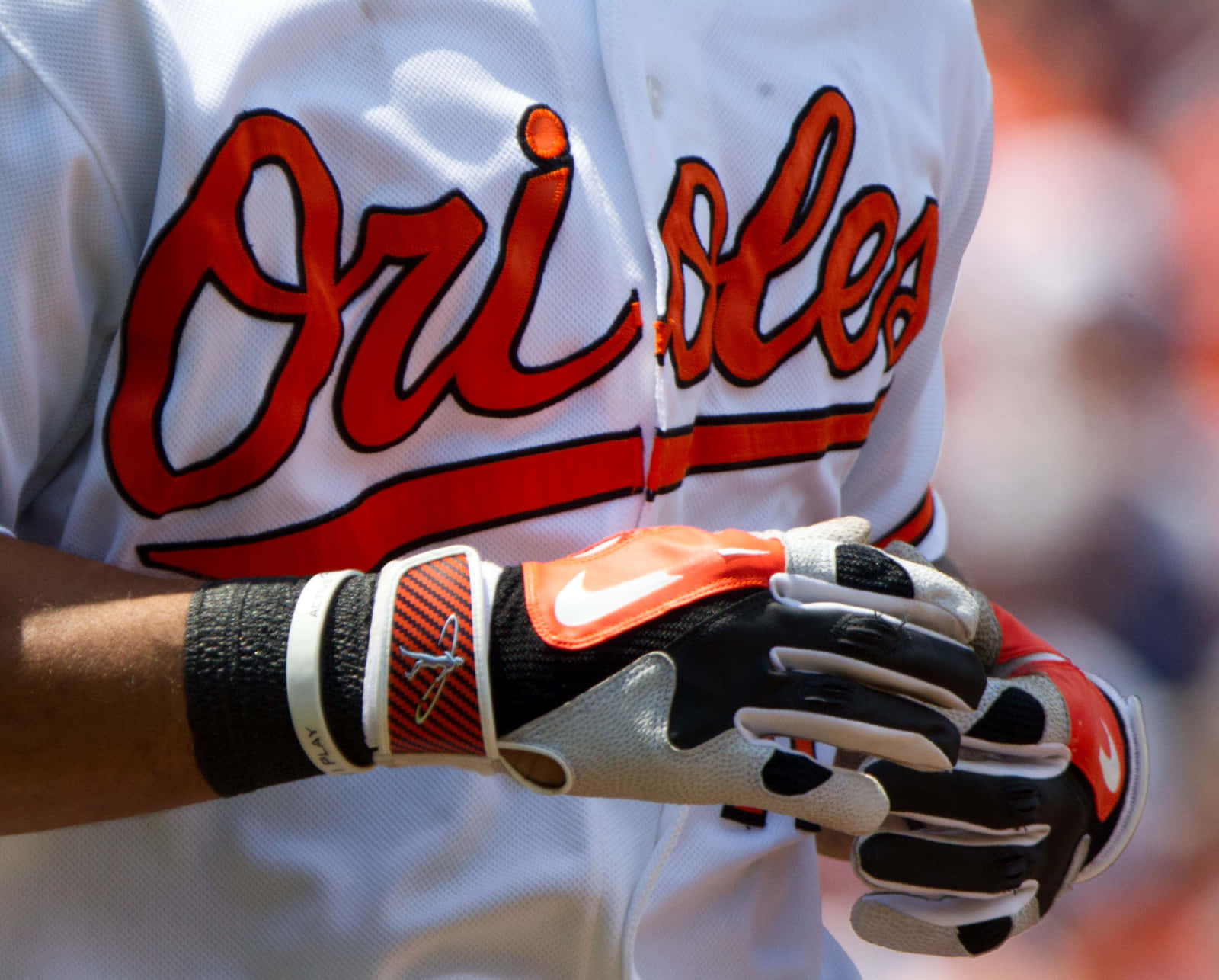 Player Holding A Baseball Glove On The Field Wallpaper