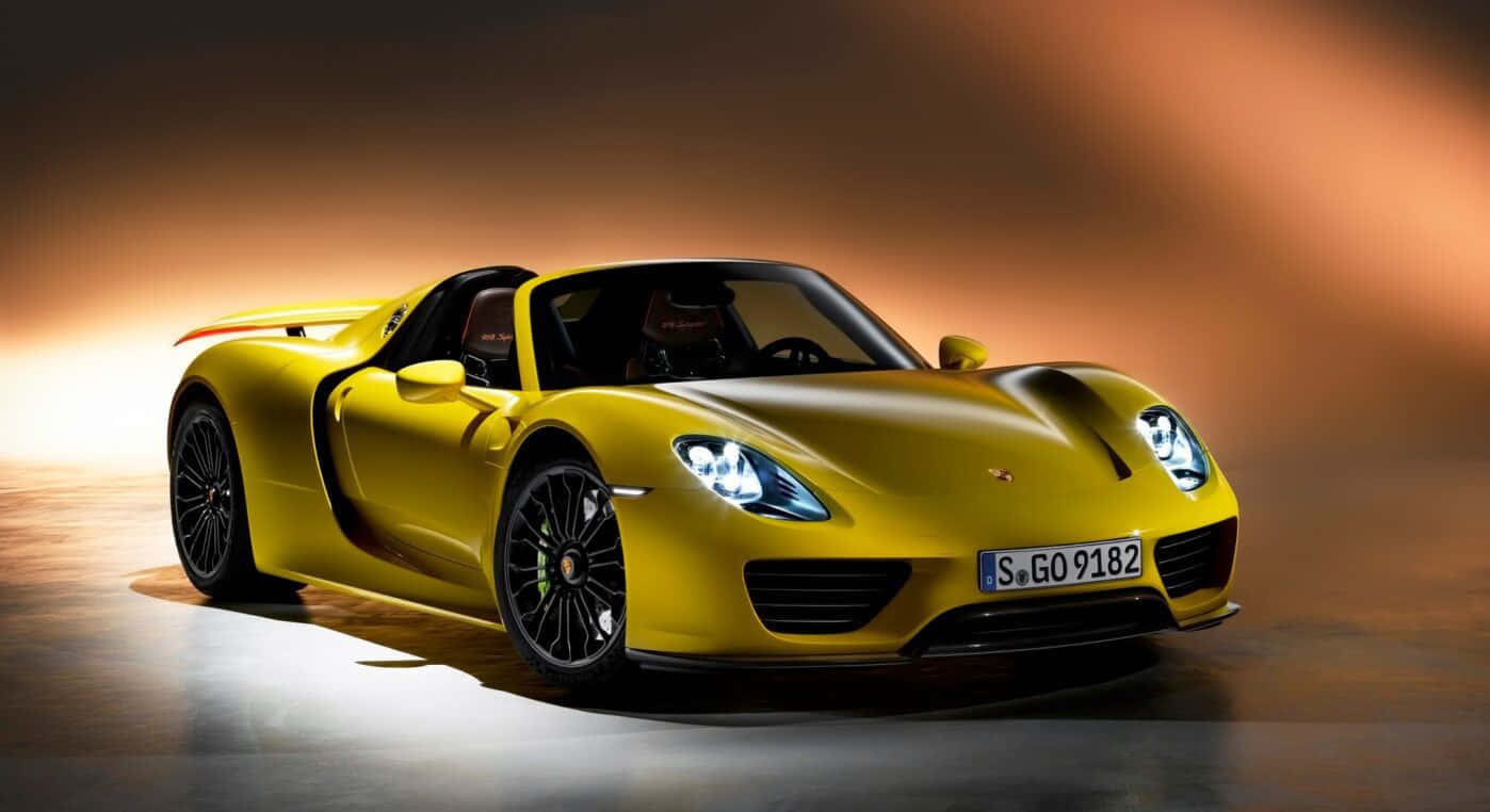 Porsche 918 Spyder Boasting Sleek Design And Speed On An Open Road. Wallpaper