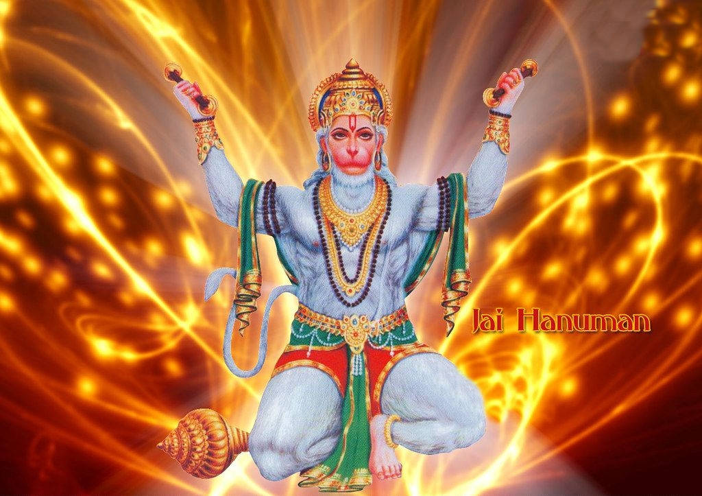 Powerful Depiction Of Jai Hanuman In Flames Wallpaper